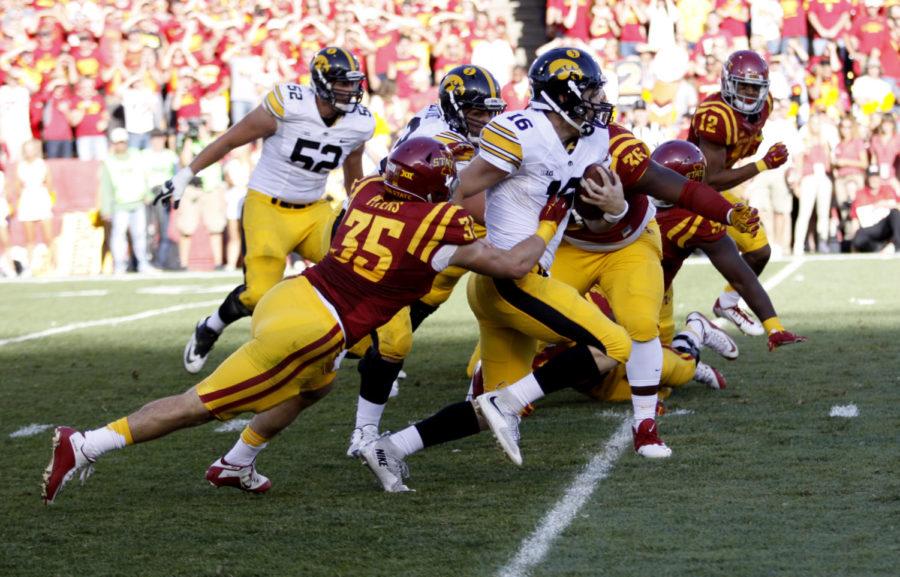 Linebacker Levi Peters goes for the sack against University of Iowas C.J. Beathard Saturday during the second quarter at Jack Trice Stadium. The Cyclones lost to the Hawkeyes 31-17 with the Hawkeyes scoring two touchdowns in the fourth quarter to cinch the trophy. 