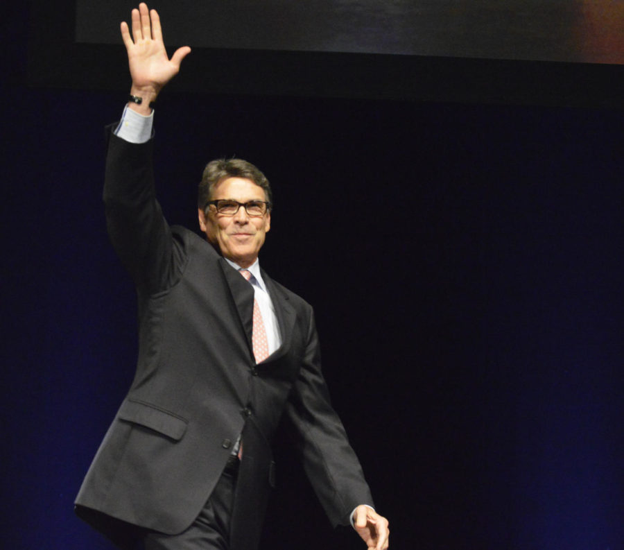 Former Texas Gov. Rick Perry makes a splash as he walks onto the stage at the Family Leadership Summit in Stephens Auditorium on July 18, 2015.