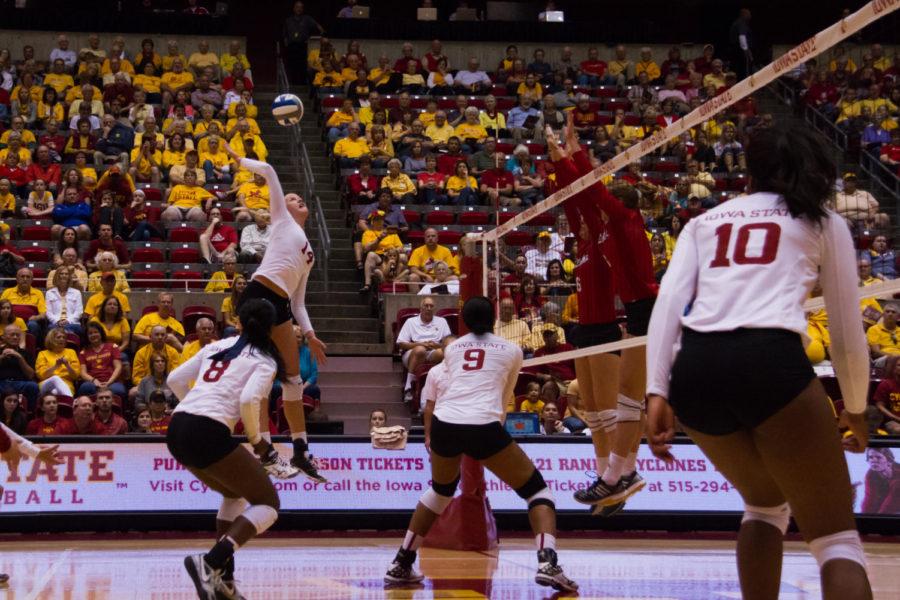 Freshman Jess Schaben jumps up for a hit over the net during the first set of a volley ball game against the Nebraska Cornhuskers. The Cyclones would go on to lose the set 25-23, and lose the game 3-1.