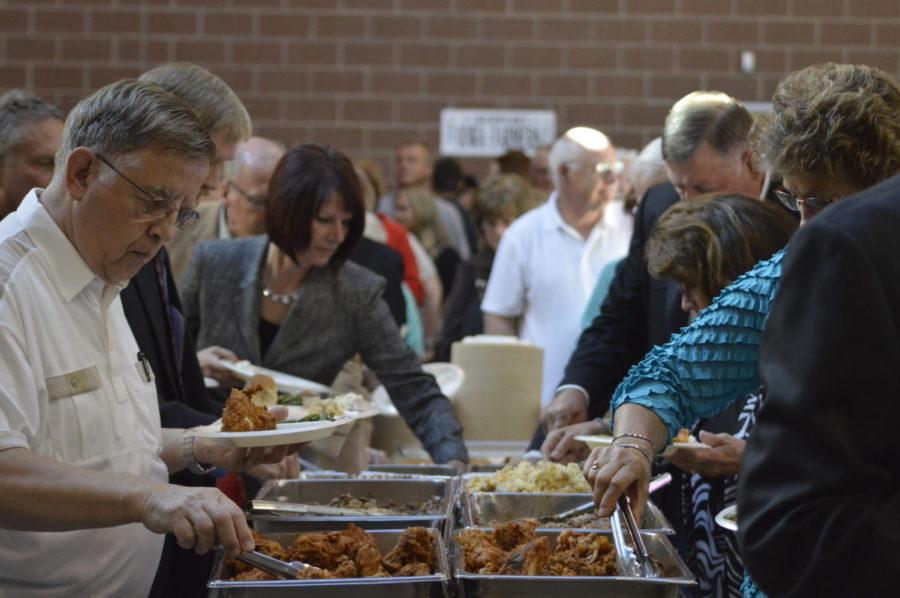 Guests of the Iowa Faith and Freedom Coalition Dinner gather around the food provided at the event on Sept. 19.