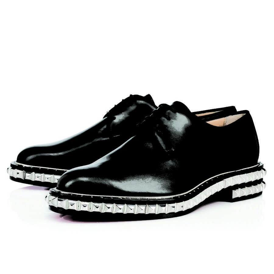 On Stage Flat, a style of womens loafer lined with silver accent studs. 