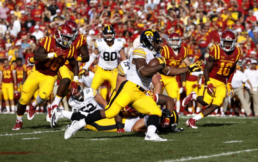 University of Iowas LeShhun Daniels, Jr. runs the ball Saturday during the second quarter of the game at Jack Trice Stadium. The Cyclones lost to the Hawkeyes 31-17 with the Hawkeyes scoring two touchdowns in the fourth quarter to cinch the trophy.