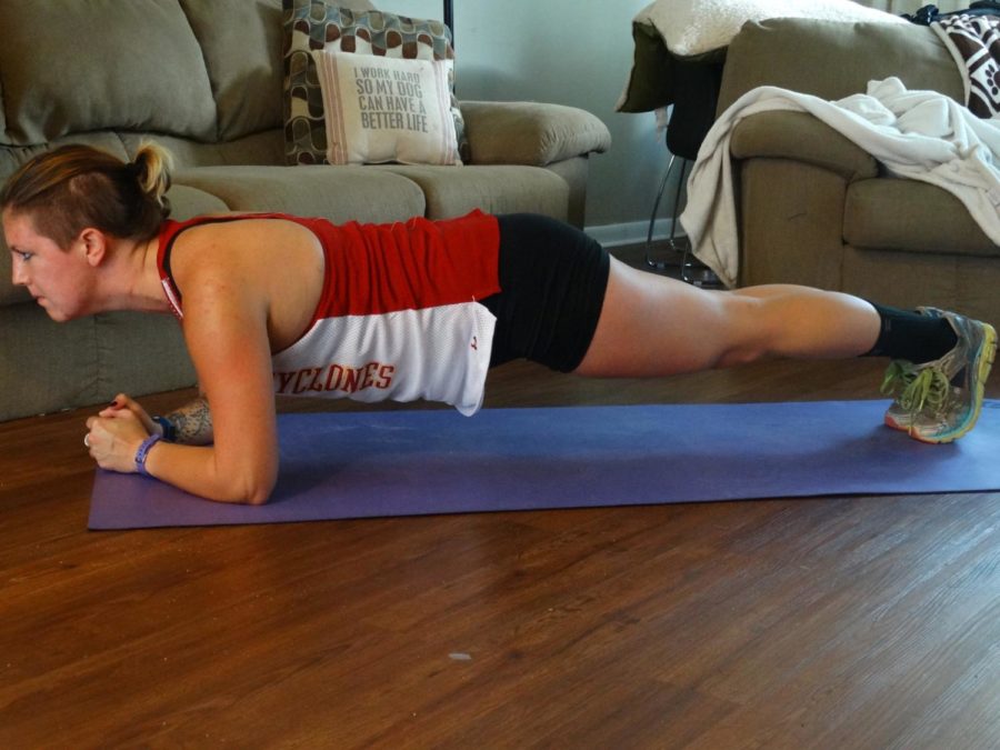 Maintain this position for 30 seconds or more to complete a vertical plank exercise.