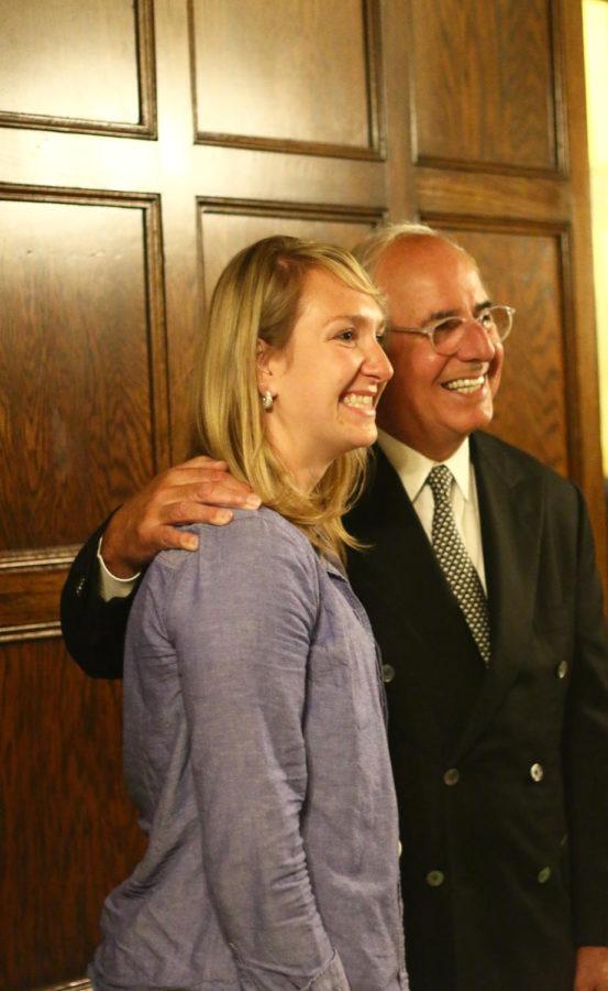 Hillary Kletscher, a graduate student in business administration poses for a photo with Frank Abagnale Monday evening. Abagnale, who inspired the movie Catch Me If You Can, spoke to students about fraud prevention.