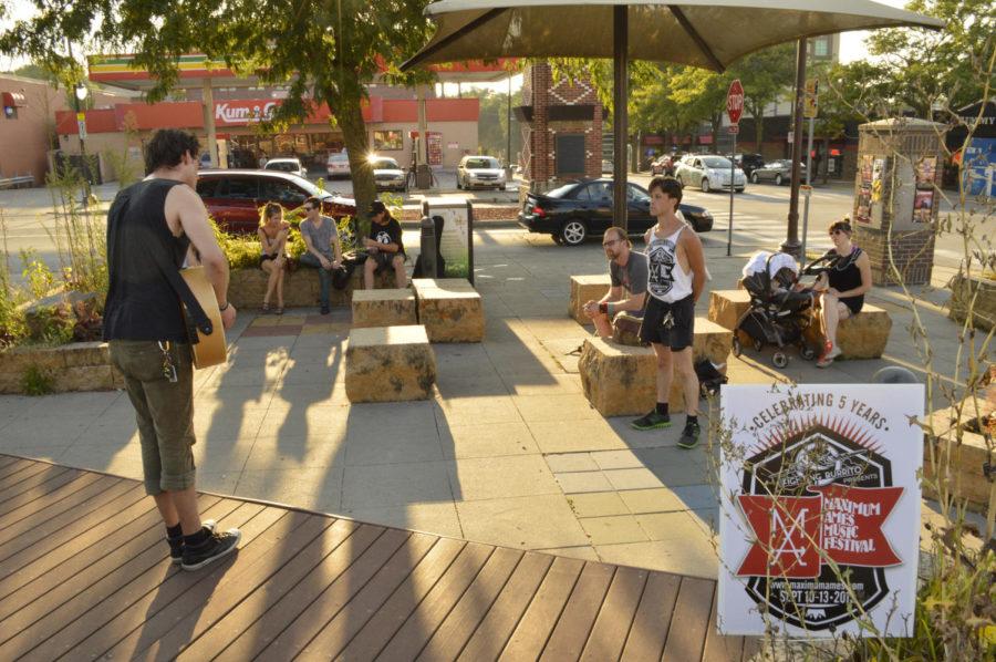 Evan Campbell performs at the Maximum Ames Music Festival burrito sampler event Sep. 2 in Campustown.