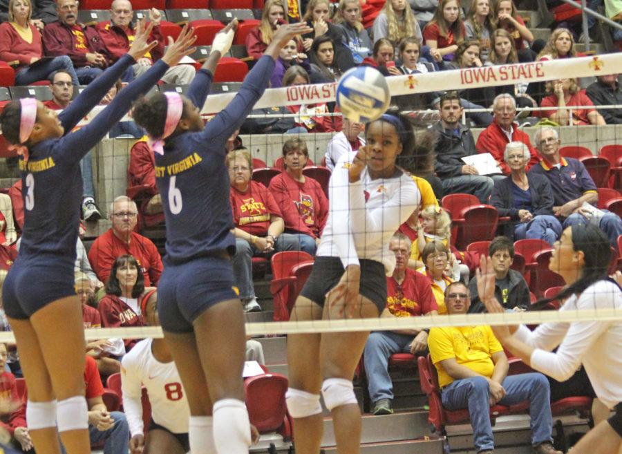 Freshman Grace Lazard spikes the ball against WVU. The Cyclones swept the mountaineers in three sets.