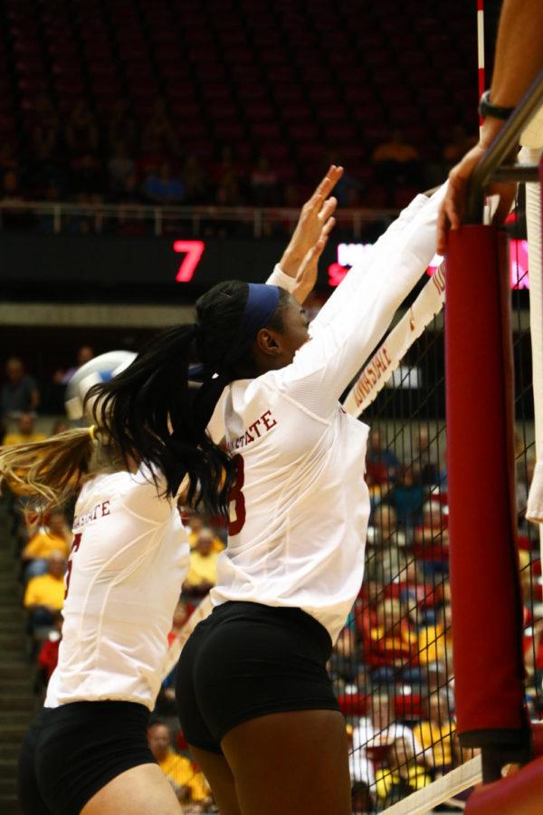Monique Harris, sophomore, blocks the ball during the game against Nebraska Saturday afternoon. Iowa State lost 3-1.