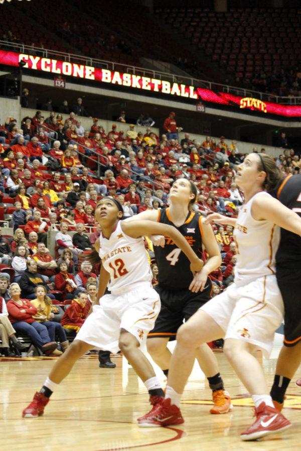 Sophomore guard Seanna Johnson boxes out an Oklahoma State player to get to the rebound. Johnson had a total of four rebounds during the Jan. 31 game. The final score was 63-62.