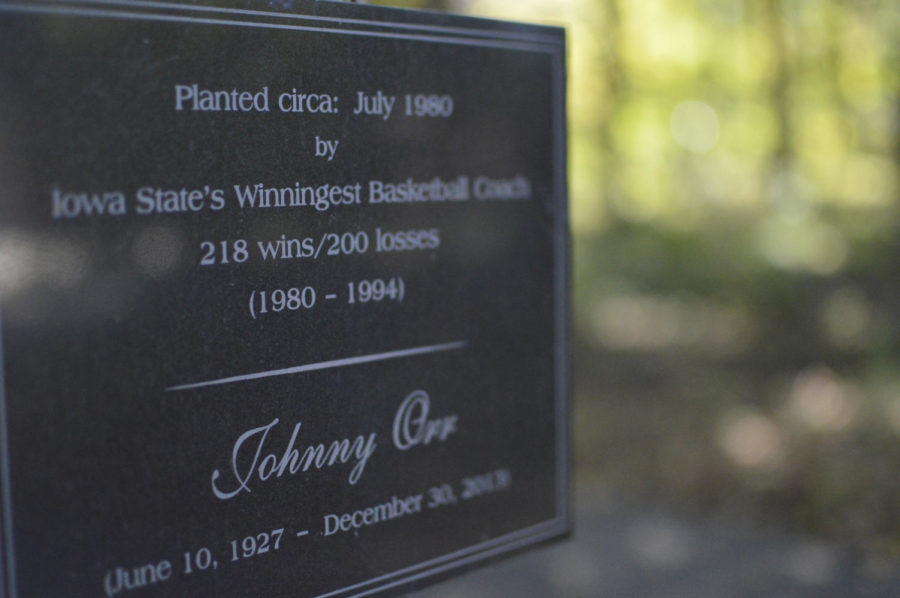 A plaque memorializing Johnny Orr, former ISU basketball coach, is attached to a tree outside of the house of Donald Wolford, Emeritus professor of physics and astronomy at ISU. Wolford purchased the house from Orr when he moved to Ames.