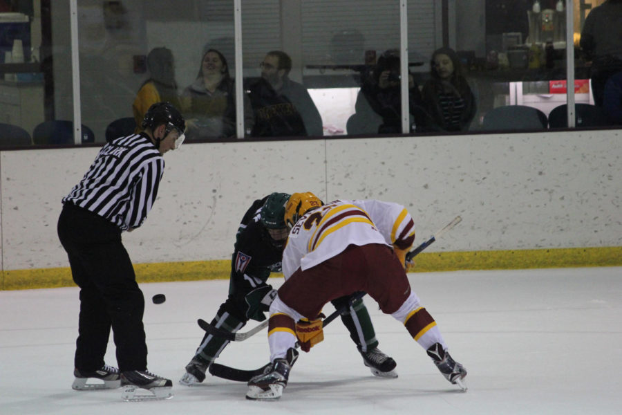 Jon Severson, freshman forward, reaches for the puck at the hockey game against the Ohio Bobcats.