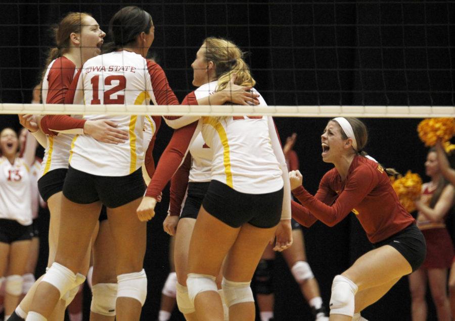 The Cyclones celebrate a point scored in the final set against Texas on Nov. 27, 2013 at Hilton Coliseum. The Cyclones lost the match 25-27, 25-17, 13-25, 16-25.