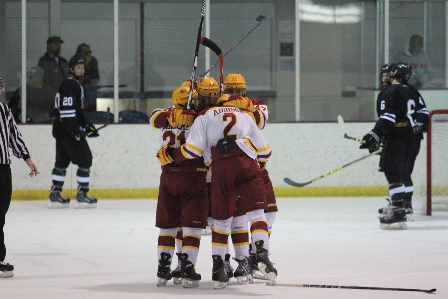 Cyclones celebrate their second goal of the game, by senior forward Alex Stephens in the third period.