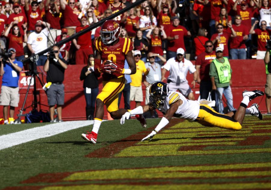 Wide receiver Quenton Bundrage scores a touchdown against University of Iowas Greg Mabin Saturday during the second quarter at Jack Trice Stadium. The Cyclones lost to the Hawkeyes 31-17 with the Hawkeyes scoring two touchdowns in the fourth quarter to cinch the trophy.