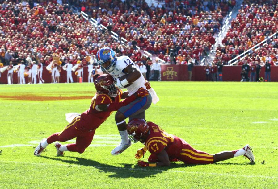 Iowa State defensive back Quijuan Floyd tackles Kansas wide receiver Darious Crawley. The Cyclones would go on to beat the Jayhawks 38-13.