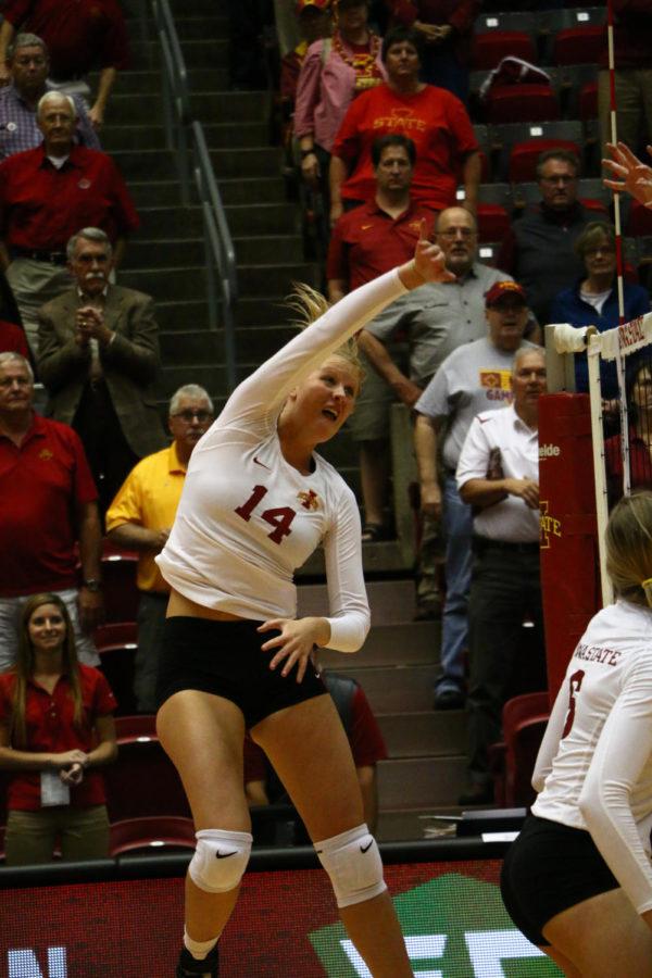 Freshman+Jess+Schaben+spikes+the+ball+during+the+game+against+Kansas+State+Wed.+evening.+Schaben+had+five+digs+throughout+the+three+sets.