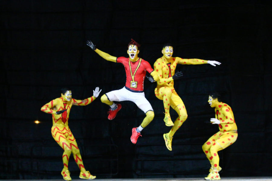 Members of the greek community perform during the final round of Yell Like Hell at the pep rally Friday night.