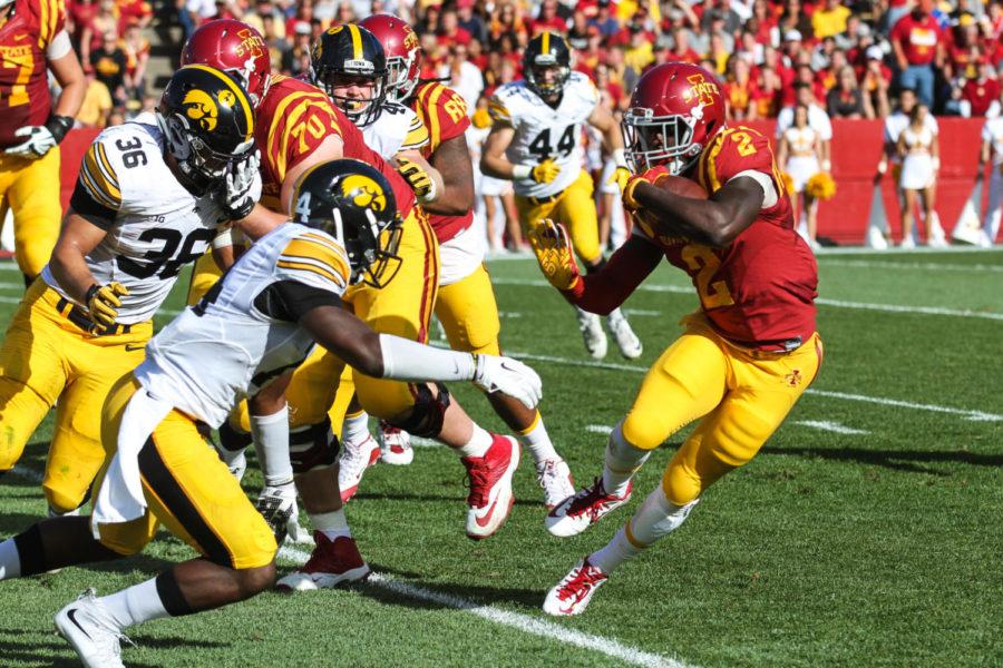 Iowa State running back Mike Warren (2) dodges tackles during the Iowa vs. Iowa State game on Saturday. 