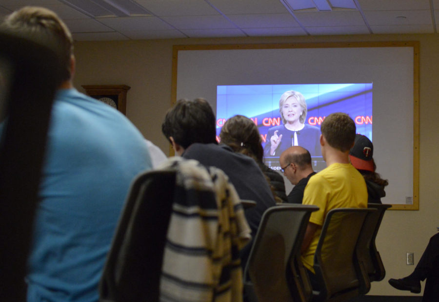 Students watch Hillary Clinton during the Democratic presidential debate. A watch party was hosted in Hamilton Hall on Tuesday. 