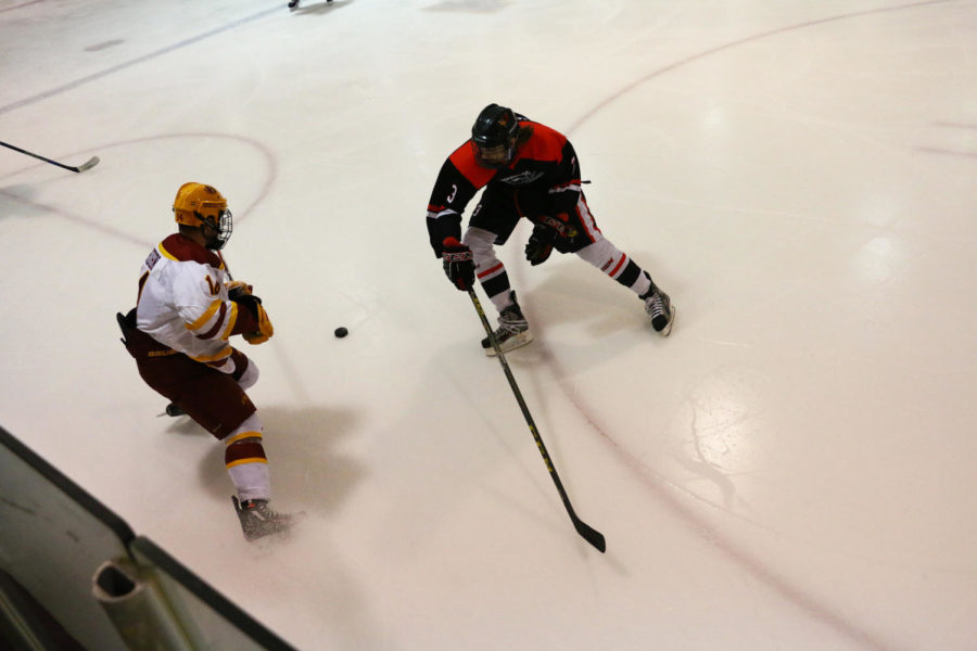 Cyclone Hockey senior forward Drew Carlson sets up a play during the game against Illinois State Friday night. The Cyclones would go on to beat the Redbirds 4-2.