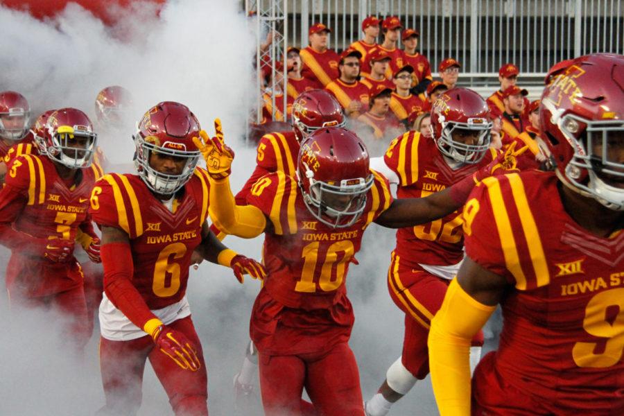 The Cyclones charge through the fog before playing the game against TCU on Oct. 17. The Cyclones would go on to lose 45-21.