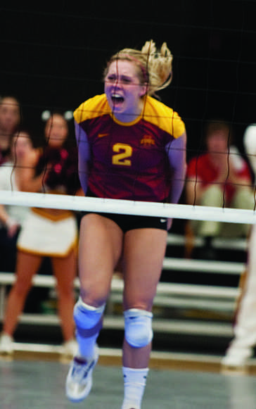 Defensive specialist and libero Ashley Mass celebrates a point against Texas A&M during the game on Saturday, Oct. 16, at Ames High School. Mass broke the Big 12 record for digs with 2,041, passing Kansas States Angie Lastra, who had 2,032.