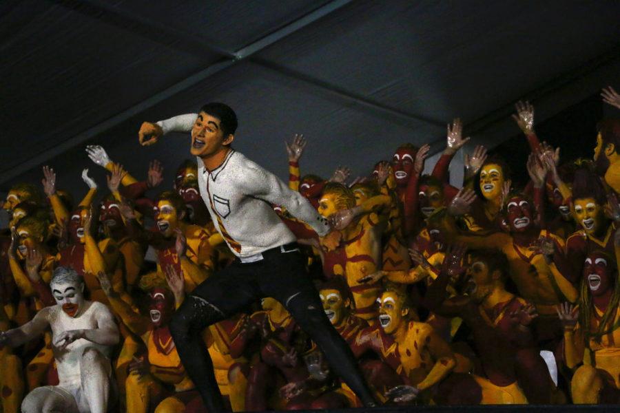 Members of the greek community perform a routine during the second round of Yell Like Hell Wednesday night. Each of the eight remaining teams were judged on pep and enthusiasm, creativity and uniqueness, movement precision, yelling expression, portrayal of the homecoming theme and incorporation of the improvisation phrase.