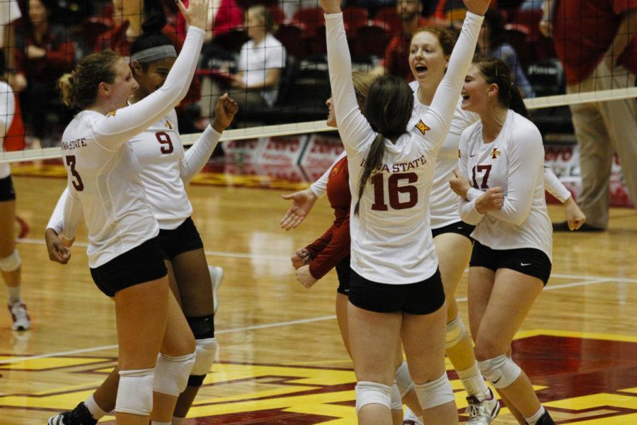 The ISU volleyball team celebrates a point during Iowa States game against Oklahoma on Oct. 12.