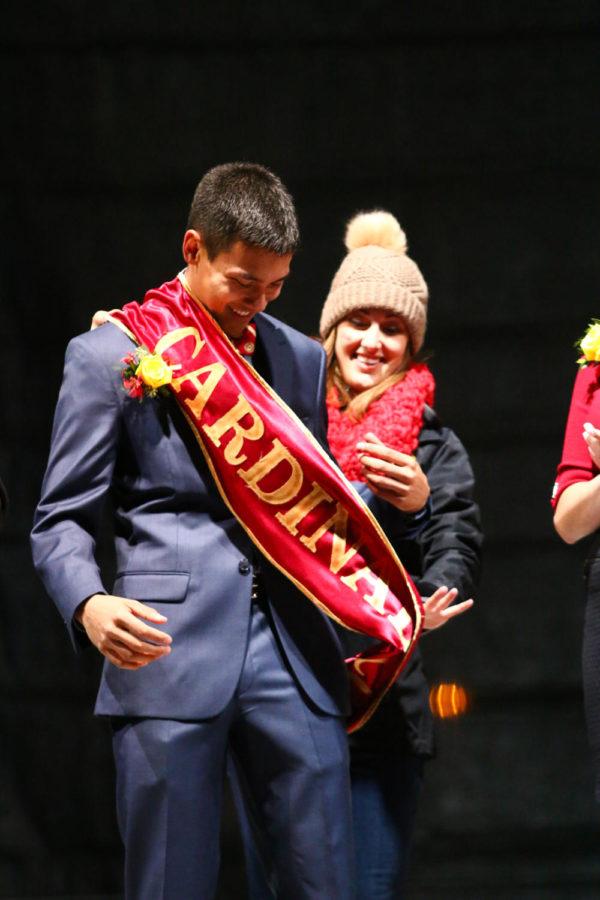 Austin Javellana, senior in landscape architecture, is crowned Cardinal Court King during the pep rally Friday night.