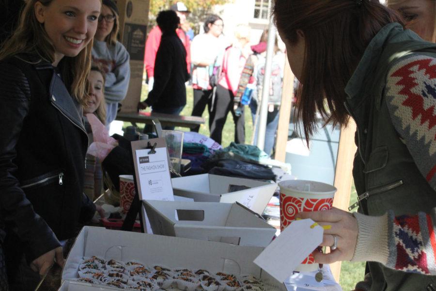 Members of student organization, The Fashion Show sold miniature donuts at the Food & Fun Fest at the south MacKay entrance on Friday.  
