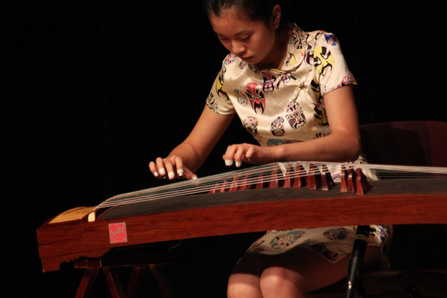 Contestant playing the traditional Chinese Guzheng, an ancient string instrument, at Asian Idol. The cultural talent competition was held in the Great Hall of the Memorial Union on Saturday.   