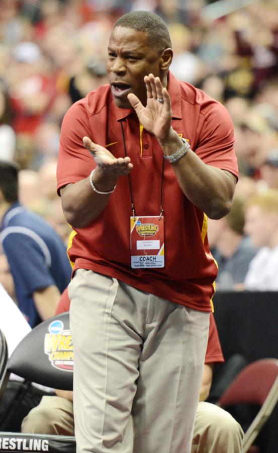 Coach Kevin Jackson cheers for Michael Moreno during his match against Stanfords Bret Baumbach in the 165-pound wrestlebacks at the 2013 NCAA Division I Wrestling Championships on March 22, 2013 at Wells Fargo Arena in Des Moines.
