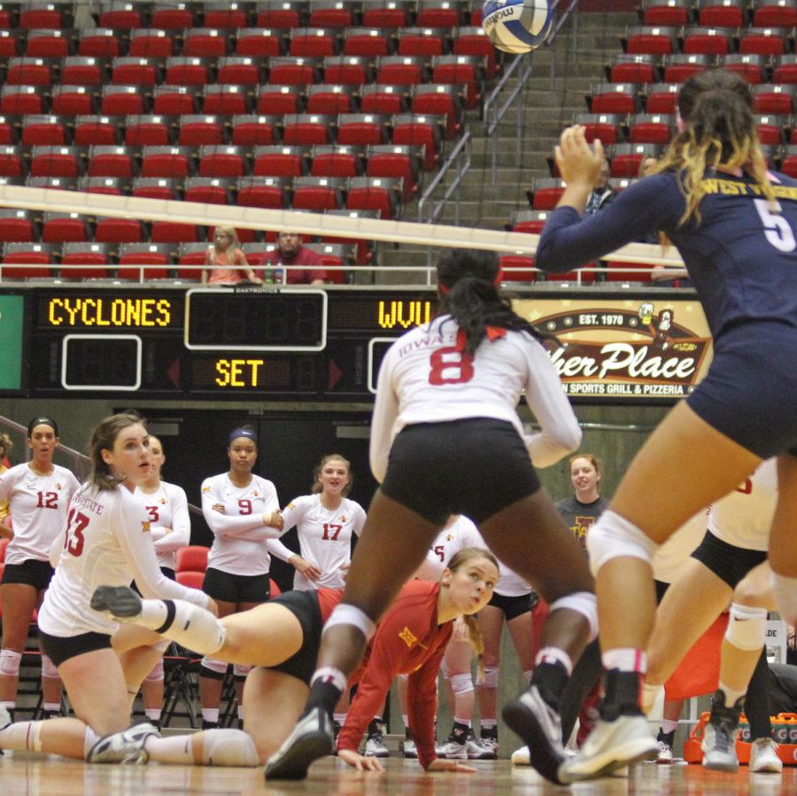 Senior libero Caitlin Nolan gets a dig against WVU. The Cyclones swept the mountaineers in three sets.