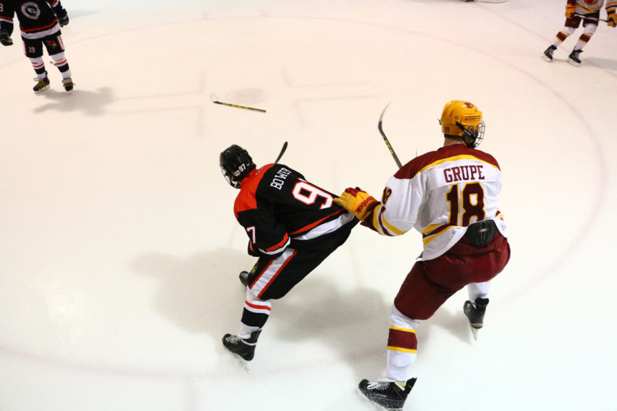 Cyclone+Hockey%C2%A0sophomore+forward+Alex+Grupe+looks+for+the+puck+during+the+Illinois+State+game+Friday+night.+The+Cyclones+would+go+on+to+beat+the+Redbirds+4-2.