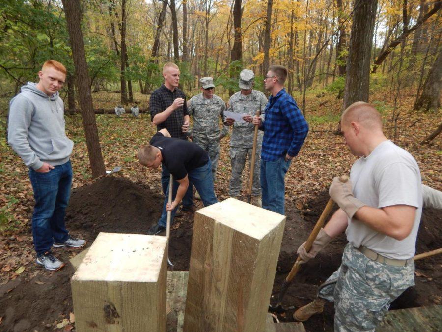 AROTC cadets and a few National Guard members start preparation for the new bridge in Pammel Woods. The planning for the bridge has been a year in the making.