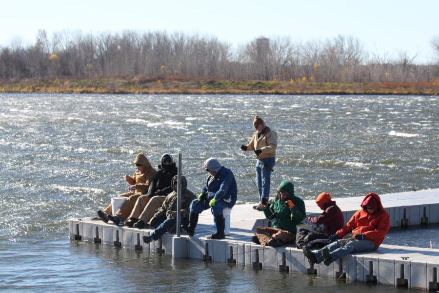 Fishermen await the release of roughly 2,000 trout by the Iowa Department of Natural Resources truck at Ada Hayden Park in Ames on November 19th. 