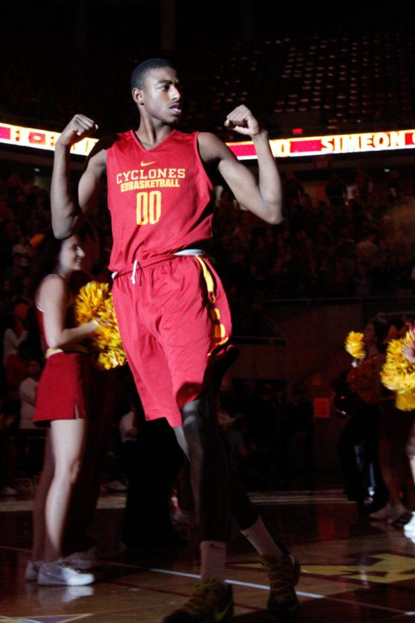 Freshman forward Simeon Carter runs through the tunnel during the opening ceremony of Hilton Madness on Oct. 16 in Hilton Coliseum. 