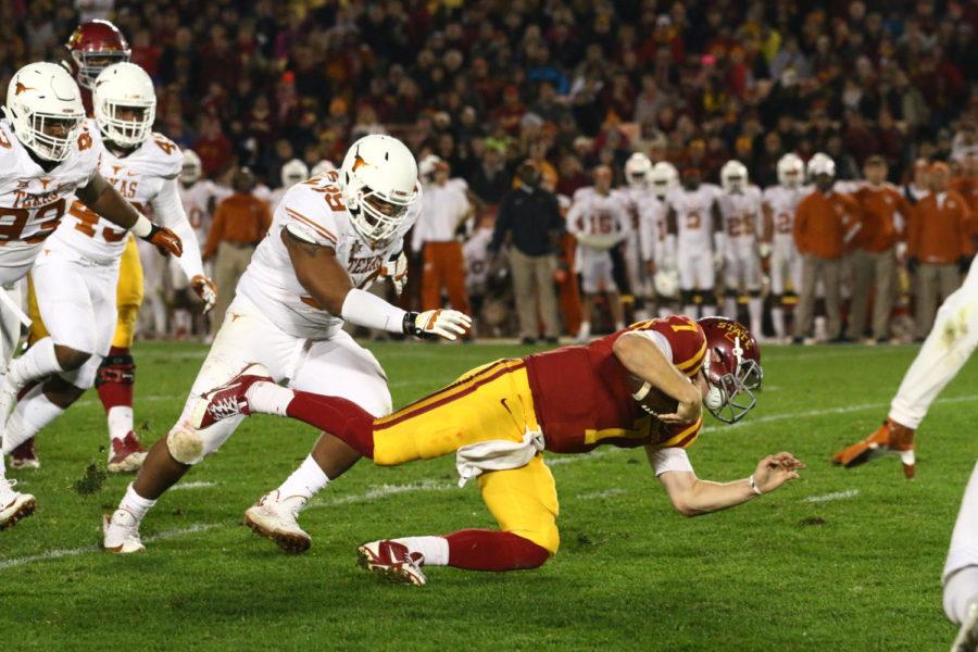 ISU quarterback Joel Lanning falls after a run against Texas on Saturday night. The Cyclones defeated the Longhorns in a 24-0 shutout.