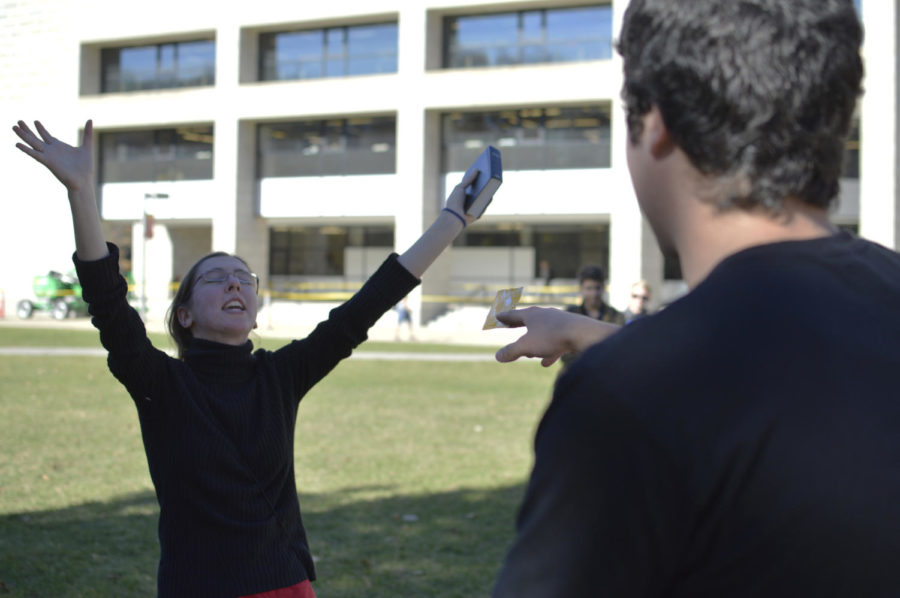 A student attempts to give Sister Kirsten a condom during her preachings in the Agora outside Parks Library Nov. 2, 2015.