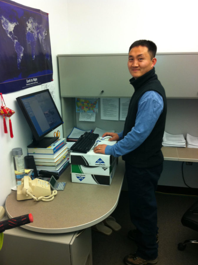Duck-Chul Lee, assistant professor of kinesiology, displays a standing desk, which has proven to have health benefits. 