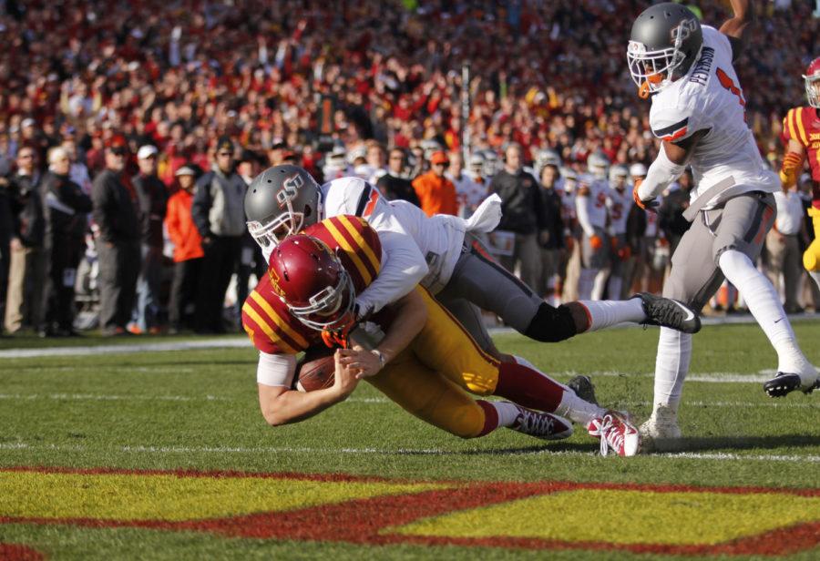 Iowa States Joel Lanning (7) scores a touchdown against Oklahoma States defense on Saturday November 14, 2015 during the first quarter in Jack Trice Stadium in Ames, Iowa. The Cyclones led the Cowboys 24-14 going into the half during their last home game of the regular season.