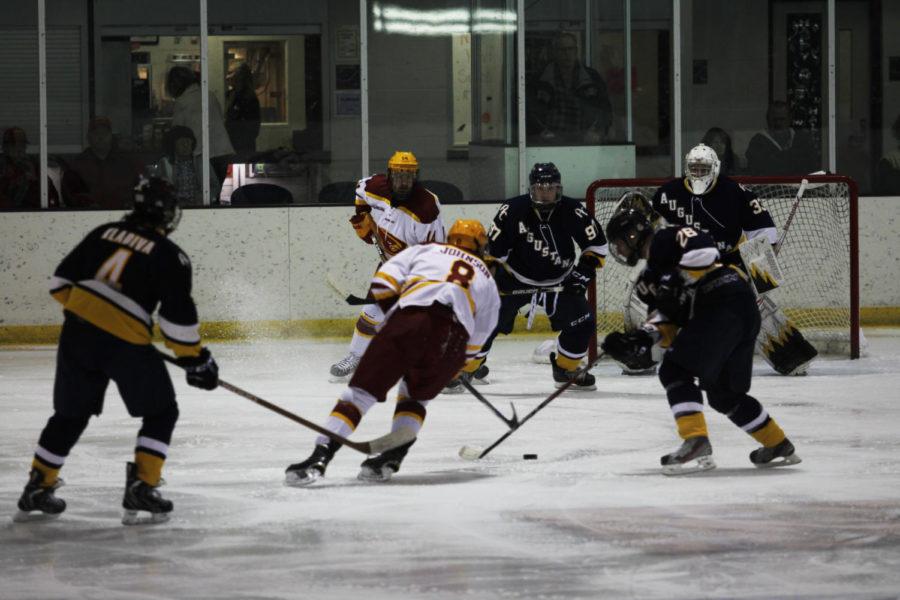 Sophomore forward Zack Johnson handles the puck at the game Oct. 30.