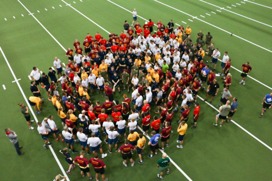 Iowa State ROTC cadets and midshipmen regroup after the warrior workout at the Lied Rec Center Wed. morning. This particular workout was unique because Team RWB became involved for Veterans Day. Team RWB is a nationwide organization whose mission is to enrich the lives of Americas veterans by connecting them to their community with physical and social activities.
