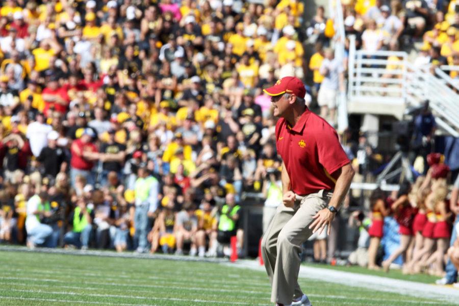 ISU head football coach Paul Rhoads directs players during the game against Iowa on Saturday, Sept. 8, at Kinnick Stadium in Iowa City. The Cyclones beat the Hawkeyes, 9-6. 