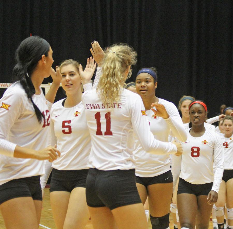 The volleyball team celebrates a win against WVU. The Cyclones swept the mountaineers in three sets. Pictured: senior Tory Knuth, junior Ciara Capezio, junior Natalie Vondrak, sophomore Samara West, sophomore Monique Harris and freshman Abby Phillips.