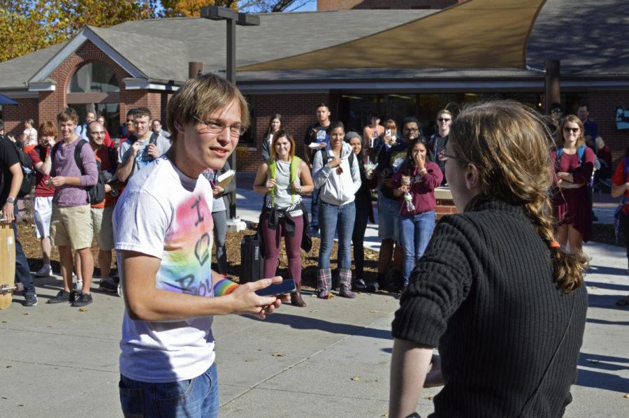 Nicholas Bitz, junior in electrical engineering, poses a question about homosexuality to Sister Kirsten in the free speech zone outside Parks Library Nov. 2.