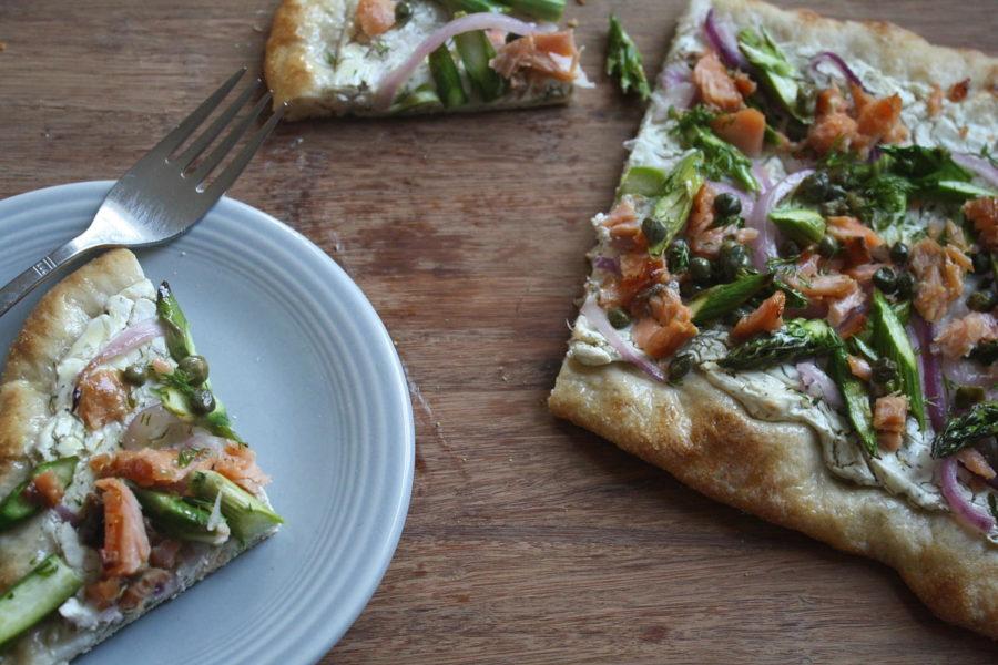 Pick up pizza dough from local restaurant or pizzeria for a cheap shortcut. Combine smoked salmon with fresh vegetables for a light appetizer.  