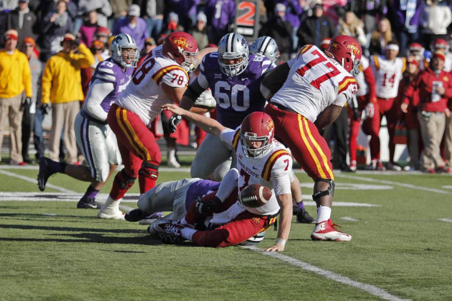 Quarterback Joel Lanning gets hit from behind and fumbles the ball, which was then recovered by Kansas State. The Wildcats rallied back to win the game 38-35 on a last second field goal at Bill Snyder Family Stadium in Manhattan, Kan., on Nov. 21, 2015.