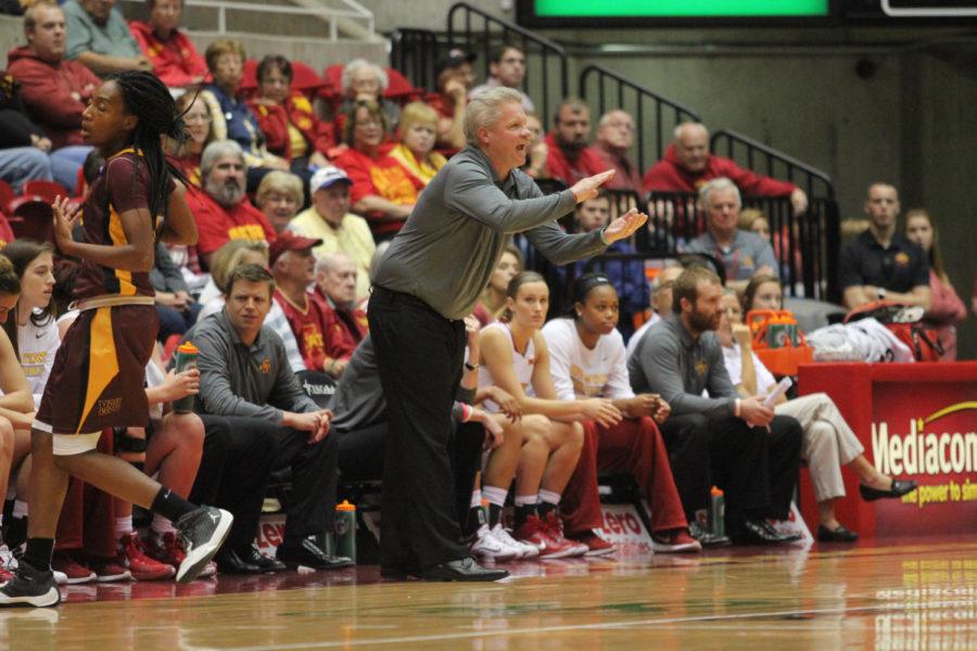 Bill Fennelly, coach, stands up and yells at the Womens Basketball exhibition game. Iowa State won 79-36 against Midwestern State University on Nov. 5.