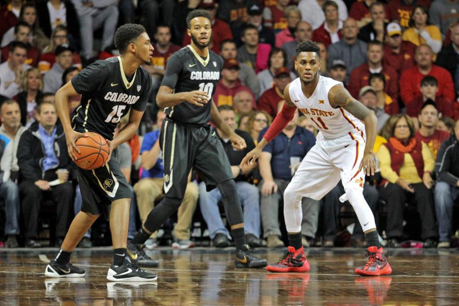 Point guard Monté Morris guards Colorados Dominique Collier in the first half of the 2015-2016 season opener on Nov. 13. No. 7 Iowa State beat Colorado 68-62 in Sioux Falls, S.D. at the Sanford Pentagon Arena.