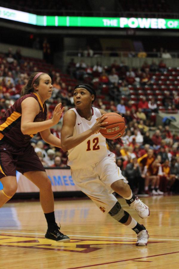Seanna Johnson, junior guard, prepares to shoot the basketball at the ISU Womens Basketball exhibition game. Iowa State won 79-36 against Midwestern State University.
